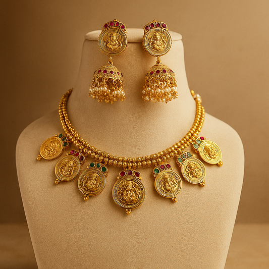 Elegant gold jewelry set featuring a necklace and earrings