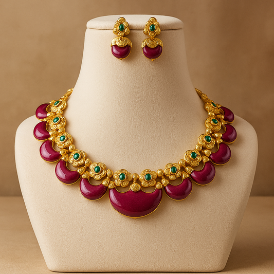 gold-plated necklace and earrings set adorned with vibrant red stones